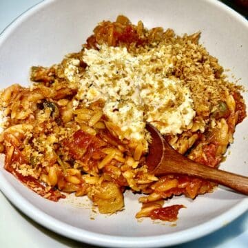 Comforting veggie pasta casserole with breadcrumbs and cheese, healthy and hearty vegetarian meal.