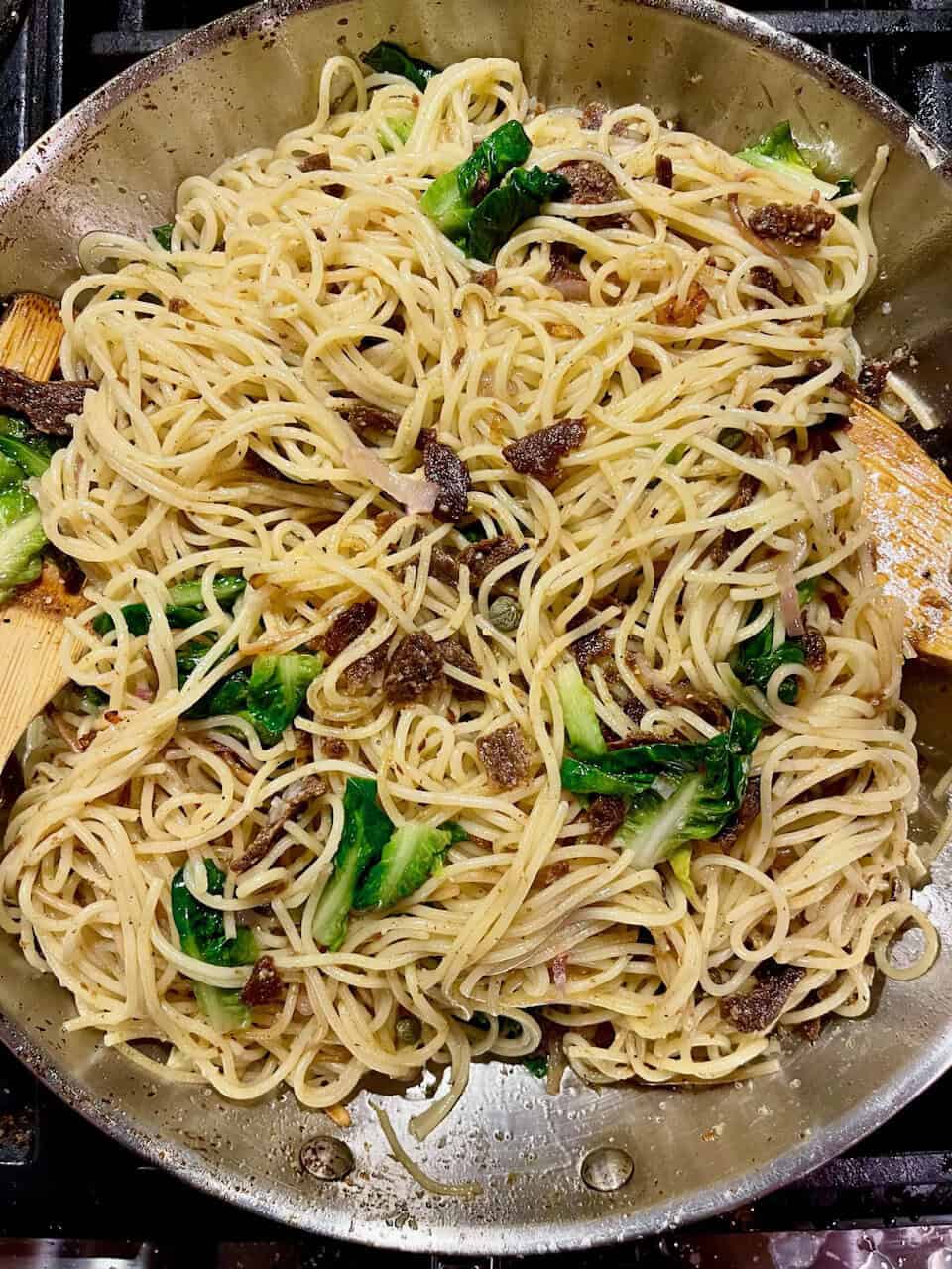 Savory vegan stir-fry with noodles, vegetables, and crispy topping for a healthy, plant-based meal.