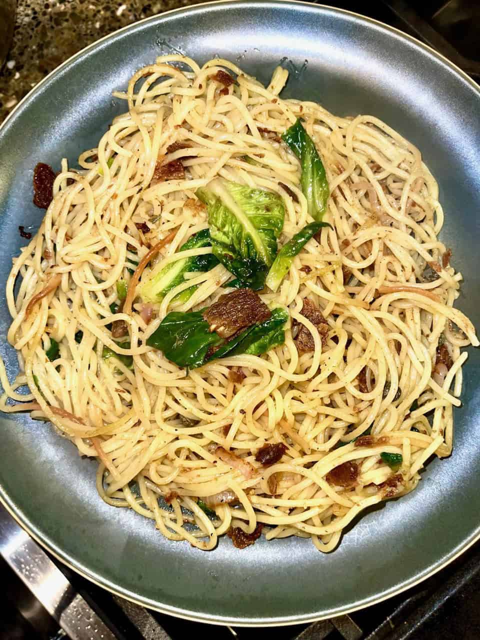 Soy sauce stir-fried noodles with greens and beef, healthy Asian-inspired meal for wellness.