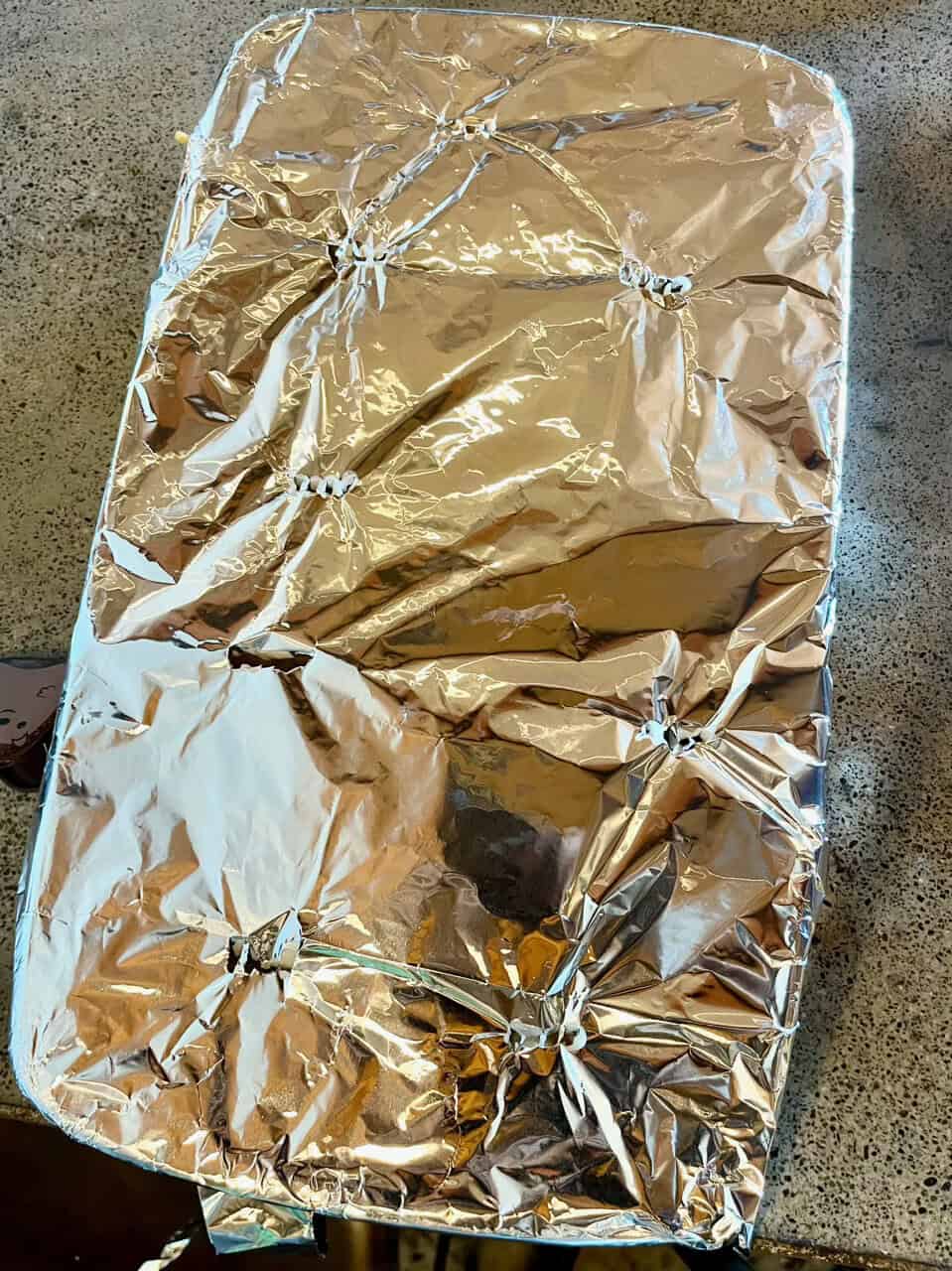 Gold foil wrapped food tray for healthy meal prep in kitchen.
