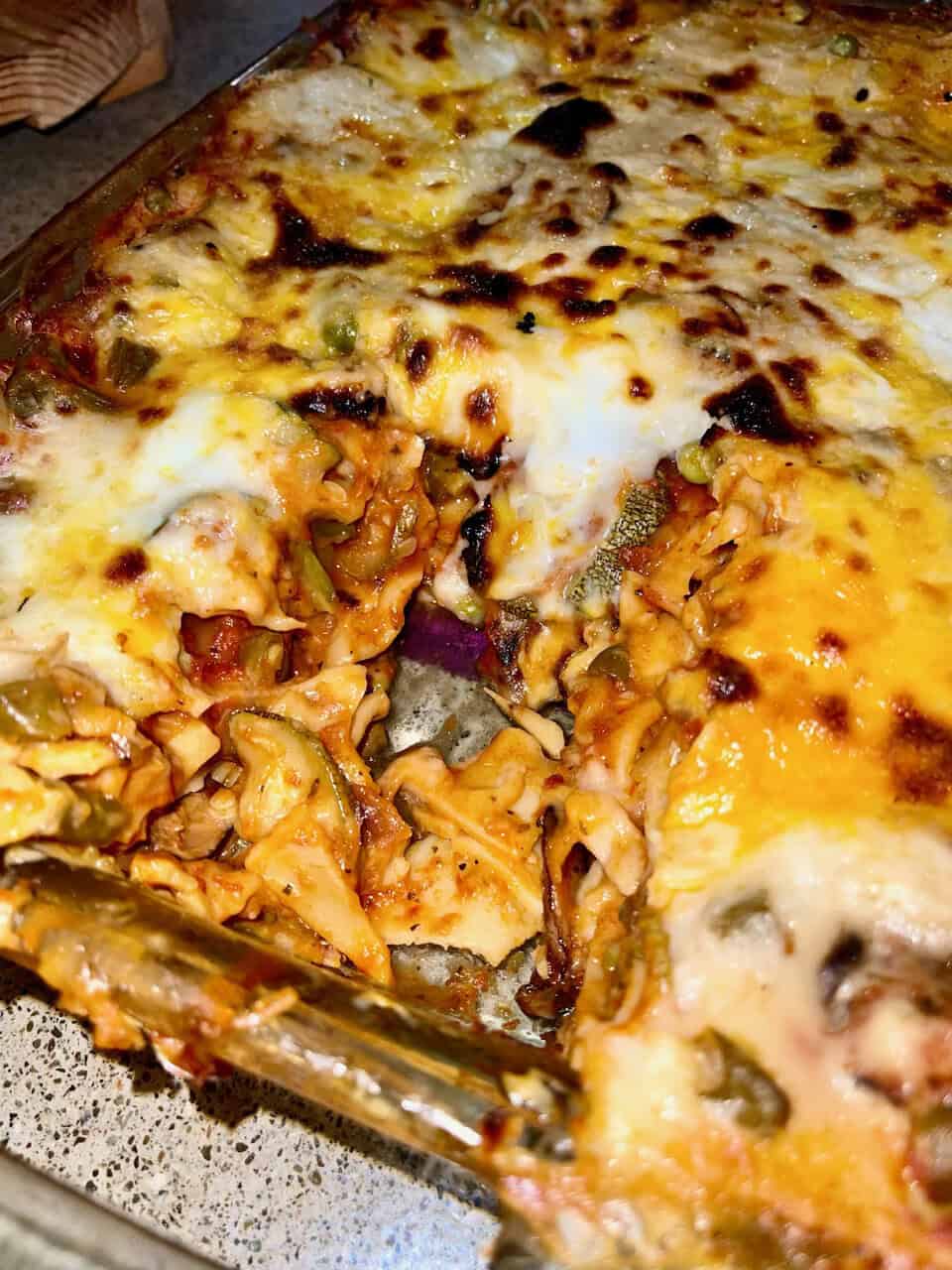 Savory homemade stuffed pasta casserole with melted cheese and vegetables.