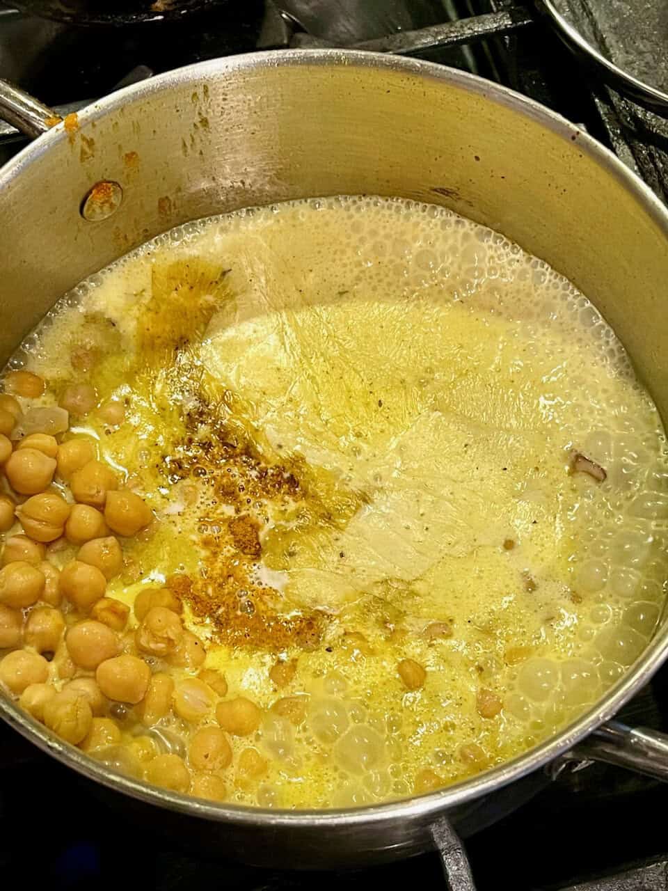 Steamed chickpeas with turmeric and spices for healthy, nourishing vegan cooking.