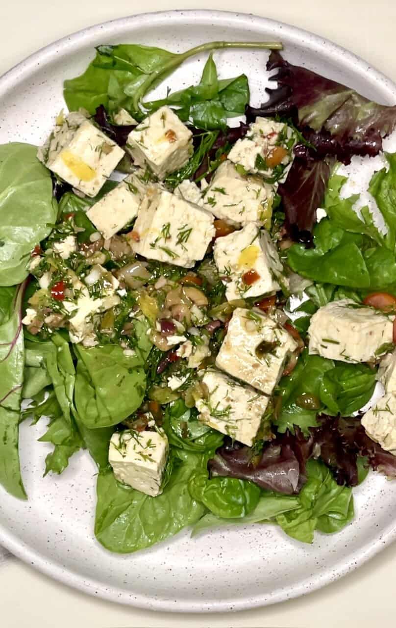 Fresh garden salad with feta cheese and mixed greens, healthy vegetarian meal option.