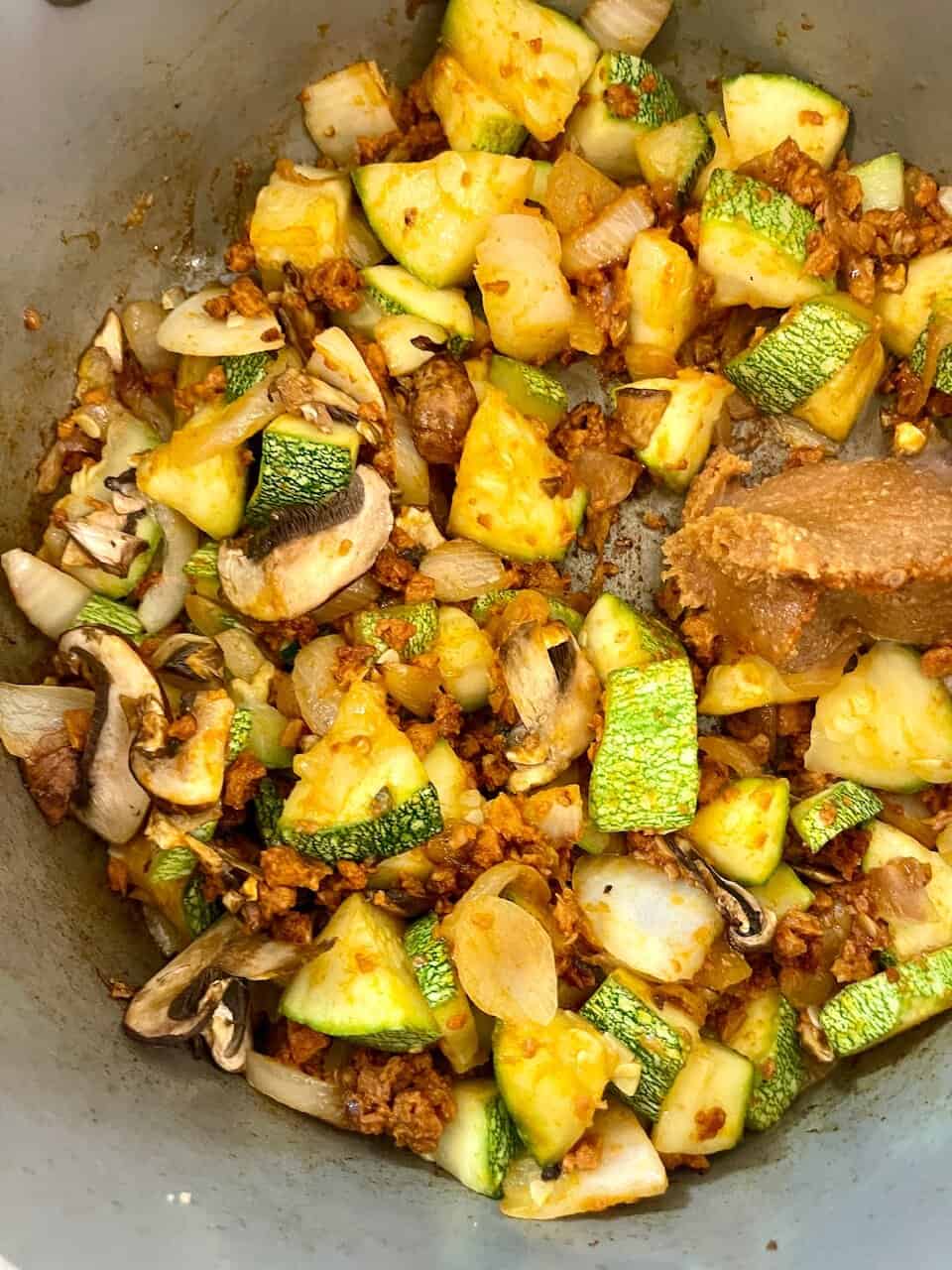 Fresh sautéed zucchini, mushrooms, and onions in a flavorful, healthy plant-based recipe for a bright, nourishing meal.