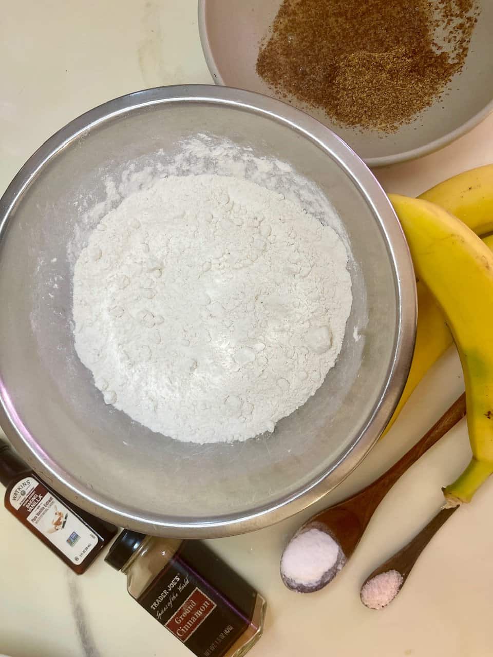 Almond flour, bananas, cinnamon, and baking ingredients for healthy baking.