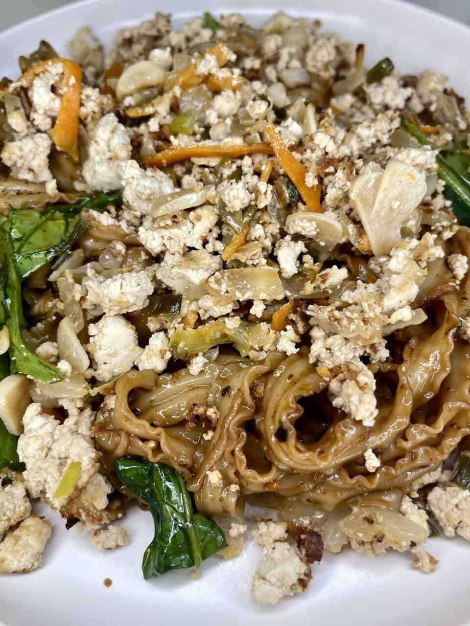 Cauliflower fried rice with vegetables and tofu, a healthy plant-based meal.