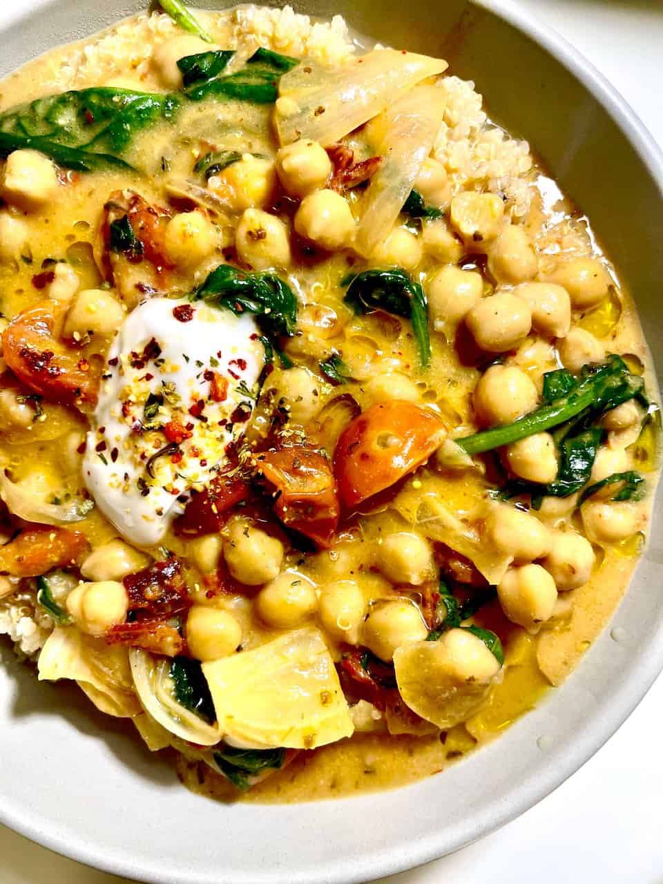 Savory chickpea curry with vegetables, yogurt, and herbs, nourishing and flavorful, perfect for healthy eating and wellness.