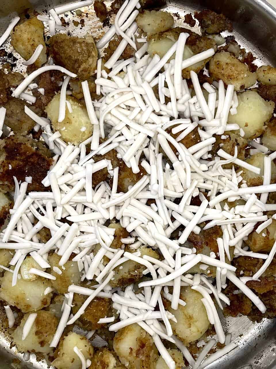 Potato casserole with cheese and breadcrumbs, comforting homemade baked dish, delicious comfort food for family dinner or gathering.