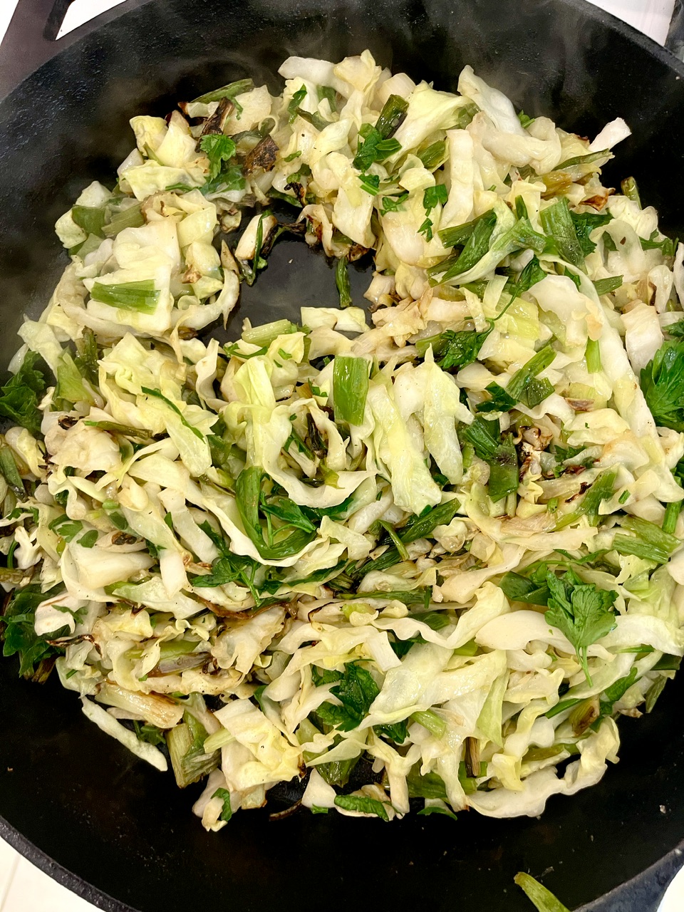 Sauteed cabbage with lemon, arugula, and crispy panko for a healthy dish.