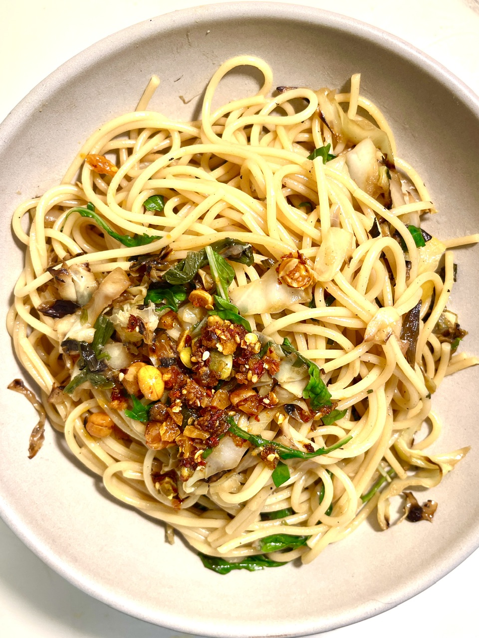 Delicious caramelized cabbage spaghetti with preserved lemon and arugula.