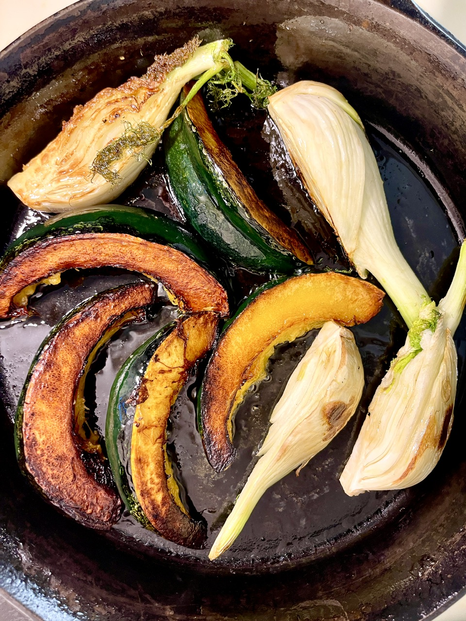 Roasted zucchini, pumpkin, and garlic for vegan yogurt beans dish.